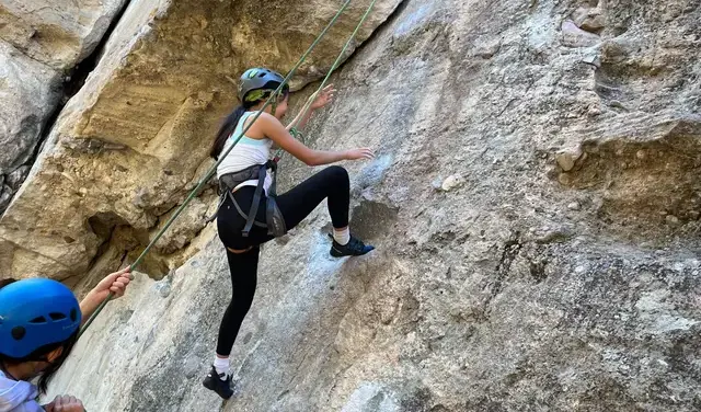 Student rock climbing